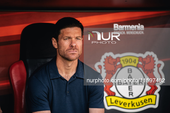 Xabi Alonso, Head Coach of Bayer 04 Leverkusen, looks on prior to the Bundesliga match between Bayer 04 Leverkusen and VfL Wolfsburg at Bay...