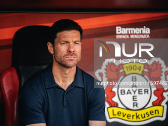 Xabi Alonso, Head Coach of Bayer 04 Leverkusen, looks on prior to the Bundesliga match between Bayer 04 Leverkusen and VfL Wolfsburg at Bay...