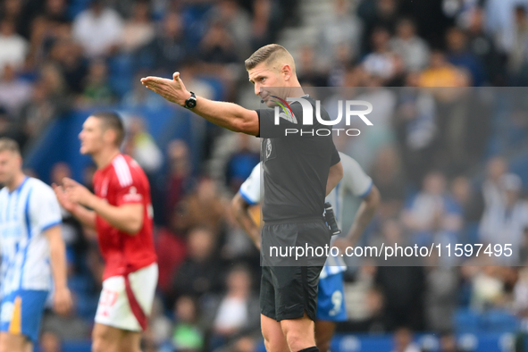 Referee Robert Jones gestures during the Premier League match between Brighton and Hove Albion and Nottingham Forest at the American Express...