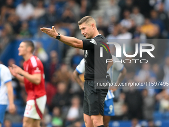 Referee Robert Jones gestures during the Premier League match between Brighton and Hove Albion and Nottingham Forest at the American Express...