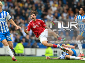 Jota Silva of Nottingham Forest gets tackled during the Premier League match between Brighton and Hove Albion and Nottingham Forest at the A...