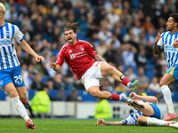 Jota Silva of Nottingham Forest gets tackled during the Premier League match between Brighton and Hove Albion and Nottingham Forest at the A...