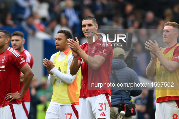 Nikola Milenkovic of Nottingham Forest applauds his team's supporters during the Premier League match between Brighton and Hove Albion and N...