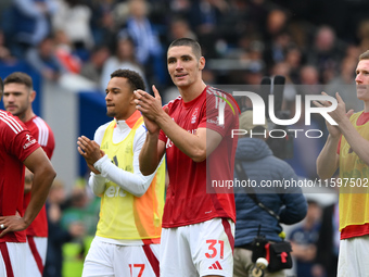 Nikola Milenkovic of Nottingham Forest applauds his team's supporters during the Premier League match between Brighton and Hove Albion and N...