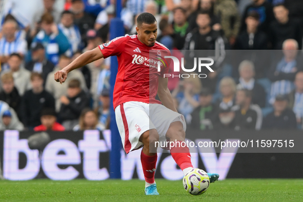 Murillo of Nottingham Forest plays the ball forward during the Premier League match between Brighton and Hove Albion and Nottingham Forest a...