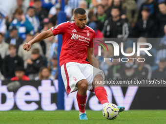 Murillo of Nottingham Forest plays the ball forward during the Premier League match between Brighton and Hove Albion and Nottingham Forest a...