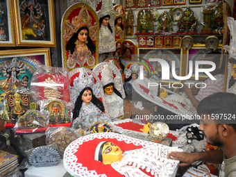 Artists make decorations for the Hindu goddess Durga inside a shop ahead of the Durga Puja festival in Kolkata, India, on September 22, 2024...