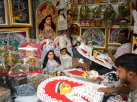 Artists make decorations for the Hindu goddess Durga inside a shop ahead of the Durga Puja festival in Kolkata, India, on September 22, 2024...