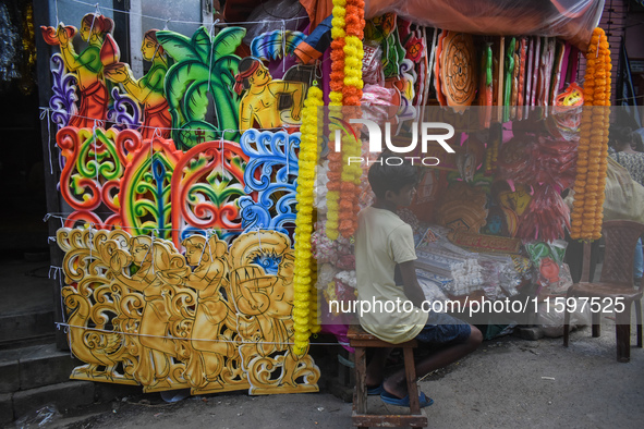 A boy sells decorations for the Durga Puja festival in Kolkata, India, on September 22, 2024. 