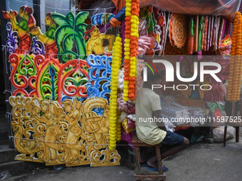 A boy sells decorations for the Durga Puja festival in Kolkata, India, on September 22, 2024. (