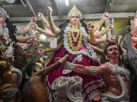 An artisan paints an idol of the Hindu goddess Durga at a workshop ahead of the Durga Puja festival in Kolkata, India, on September 22, 2024...