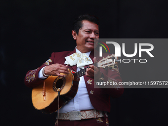 A member of Mariachi Los Gallos de Mexico performs during the Maraton de Mariachis de la Ciudad de Mexico at Zocalo main square, whose objec...