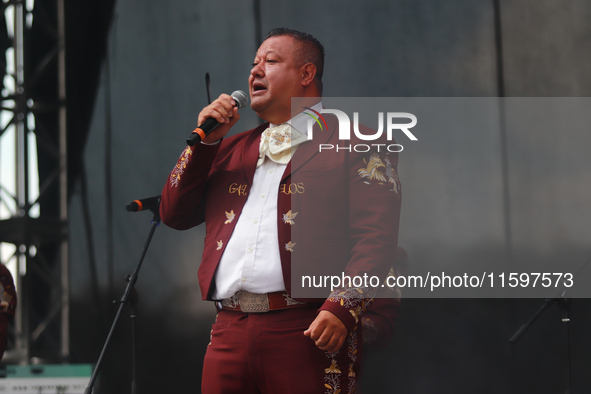 A member of Mariachi Los Gallos de Mexico performs during the Maraton de Mariachis de la Ciudad de Mexico at Zocalo main square, whose objec...