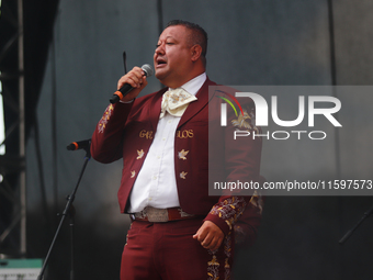 A member of Mariachi Los Gallos de Mexico performs during the Maraton de Mariachis de la Ciudad de Mexico at Zocalo main square, whose objec...