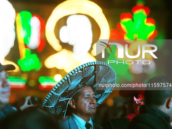 A person wears a Mariachi hat during the Maraton de Mariachis de la Ciudad de Mexico at Zocalo main square, which aims to promote and dissem...