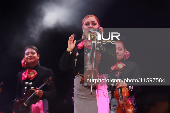 A member of Mariachi Femenil Amazonas performs during the Maraton de Mariachis de la Ciudad de Mexico at Zocalo main square, which aims to p...