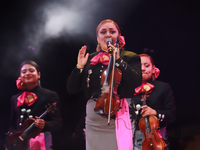 A member of Mariachi Femenil Amazonas performs during the Maraton de Mariachis de la Ciudad de Mexico at Zocalo main square, which aims to p...