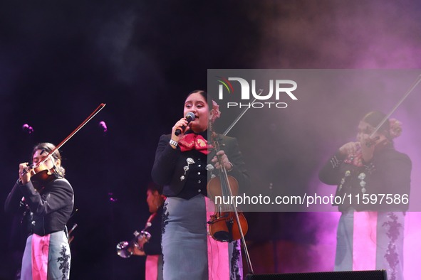 A member of Mariachi Femenil Amazonas performs during the Maraton de Mariachis de la Ciudad de Mexico at Zocalo main square, which aims to p...