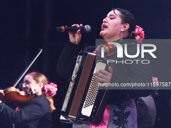 A member of Mariachi Femenil Amazonas performs during the Maraton de Mariachis de la Ciudad de Mexico at Zocalo main square, which aims to p...