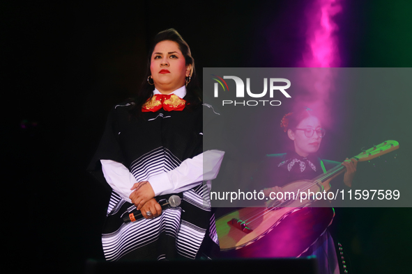 Vivir Quintana with Mariachi Mexicana Hermosa performs during the Maraton de Mariachis de la Ciudad de Mexico at Zocalo main square, whose o...