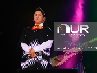 Vivir Quintana with Mariachi Mexicana Hermosa performs during the Maraton de Mariachis de la Ciudad de Mexico at Zocalo main square, whose o...