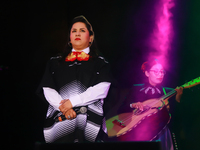 Vivir Quintana with Mariachi Mexicana Hermosa performs during the Maraton de Mariachis de la Ciudad de Mexico at Zocalo main square, whose o...