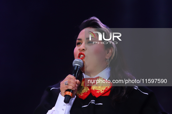 Vivir Quintana with Mariachi Mexicana Hermosa performs during the Maraton de Mariachis de la Ciudad de Mexico at Zocalo main square, whose o...