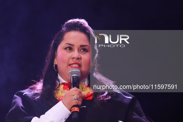 Vivir Quintana with Mariachi Mexicana Hermosa performs during the Maraton de Mariachis de la Ciudad de Mexico at Zocalo main square, whose o...