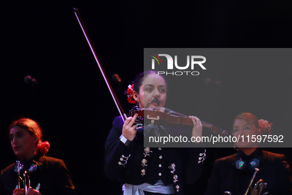 A member of Mariachi Mexicana Hermosa performs during the Maraton de Mariachis de la Ciudad de Mexico at Zocalo main square, which aims to p...