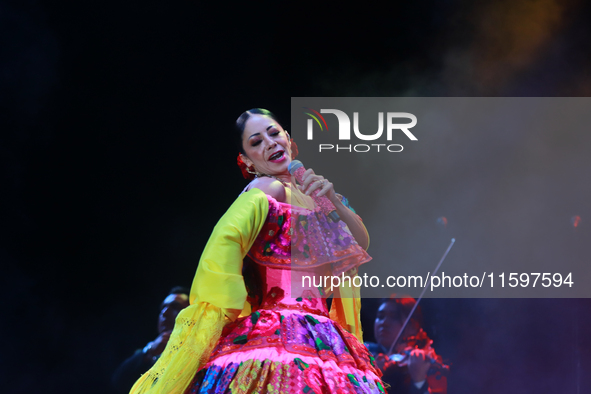 Rosy Arango with the Mariachi Internacional Estrella de Oro performs during the Maraton de Mariachis de la Ciudad de Mexico at Zocalo main s...