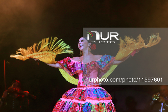 Rosy Arango with the Mariachi Internacional Estrella de Oro performs during the Maraton de Mariachis de la Ciudad de Mexico at Zocalo main s...