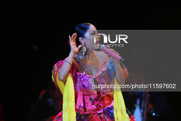 Rosy Arango with the Mariachi Internacional Estrella de Oro performs during the Maraton de Mariachis de la Ciudad de Mexico at Zocalo main s...