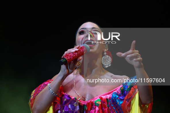 Rosy Arango with the Mariachi Internacional Estrella de Oro performs during the Maraton de Mariachis de la Ciudad de Mexico at Zocalo main s...