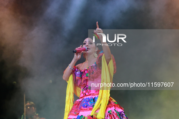 Rosy Arango with the Mariachi Internacional Estrella de Oro performs during the Maraton de Mariachis de la Ciudad de Mexico at Zocalo main s...