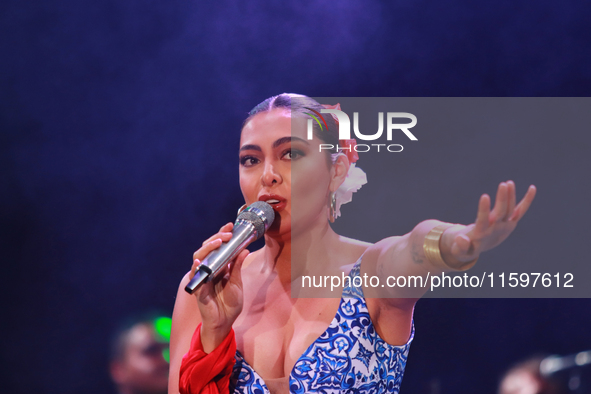 Valeria Cuevas with the Mariachi Real de la Montana performs during the Maraton de Mariachis de la Ciudad de Mexico at Zocalo main square, w...