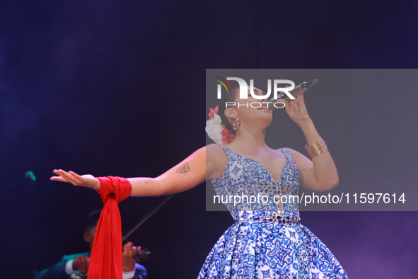 Valeria Cuevas with the Mariachi Real de la Montana performs during the Maraton de Mariachis de la Ciudad de Mexico at Zocalo main square, w...