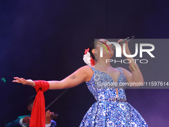 Valeria Cuevas with the Mariachi Real de la Montana performs during the Maraton de Mariachis de la Ciudad de Mexico at Zocalo main square, w...