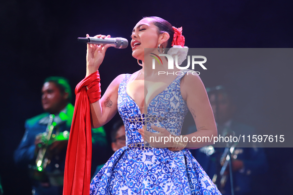 Valeria Cuevas with the Mariachi Real de la Montana performs during the Maraton de Mariachis de la Ciudad de Mexico at Zocalo main square, w...