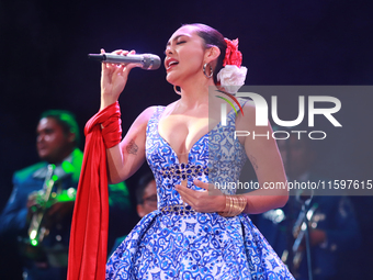 Valeria Cuevas with the Mariachi Real de la Montana performs during the Maraton de Mariachis de la Ciudad de Mexico at Zocalo main square, w...