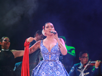 Valeria Cuevas with the Mariachi Real de la Montana performs during the Maraton de Mariachis de la Ciudad de Mexico at Zocalo main square, w...