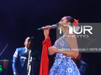 Valeria Cuevas with the Mariachi Real de la Montana performs during the Maraton de Mariachis de la Ciudad de Mexico at Zocalo main square, w...