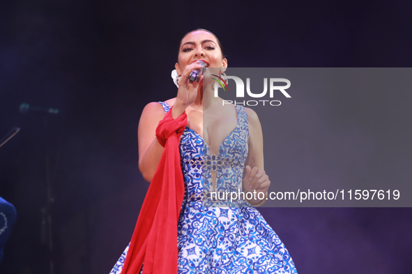 Valeria Cuevas with the Mariachi Real de la Montana performs during the Maraton de Mariachis de la Ciudad de Mexico at Zocalo main square, w...