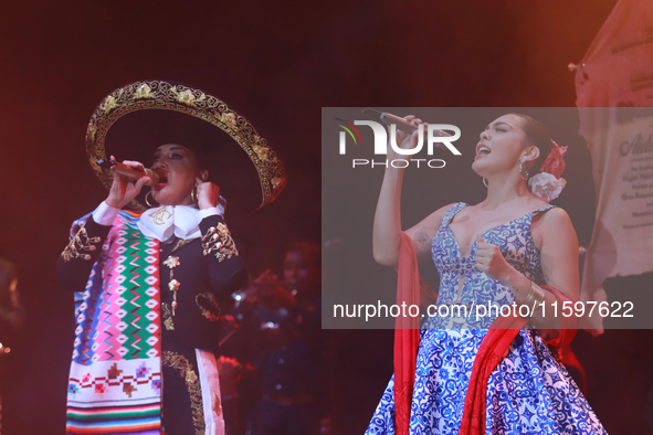 Valeria Cuevas with the Mariachi Real de la Montana performs during the Maraton de Mariachis de la Ciudad de Mexico at Zocalo main square, w...