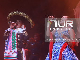 Valeria Cuevas with the Mariachi Real de la Montana performs during the Maraton de Mariachis de la Ciudad de Mexico at Zocalo main square, w...