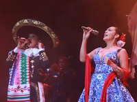 Valeria Cuevas with the Mariachi Real de la Montana performs during the Maraton de Mariachis de la Ciudad de Mexico at Zocalo main square, w...