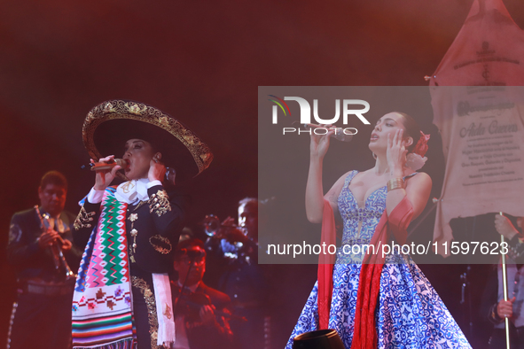 Valeria Cuevas with the Mariachi Real de la Montana performs during the Maraton de Mariachis de la Ciudad de Mexico at Zocalo main square, w...