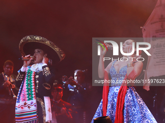 Valeria Cuevas with the Mariachi Real de la Montana performs during the Maraton de Mariachis de la Ciudad de Mexico at Zocalo main square, w...