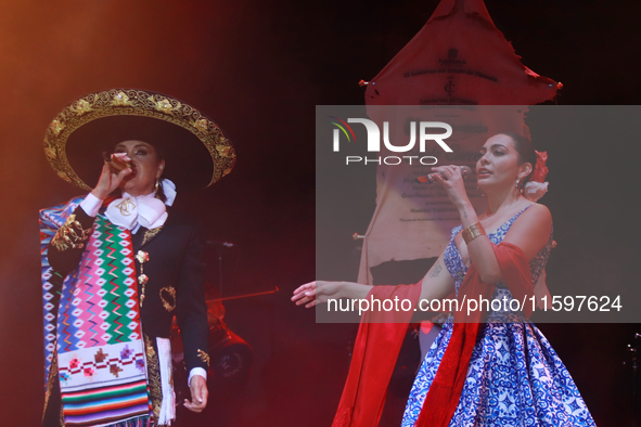 Valeria Cuevas with the Mariachi Real de la Montana performs during the Maraton de Mariachis de la Ciudad de Mexico at Zocalo main square, w...