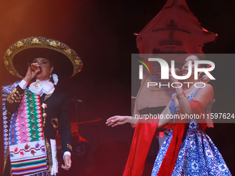 Valeria Cuevas with the Mariachi Real de la Montana performs during the Maraton de Mariachis de la Ciudad de Mexico at Zocalo main square, w...