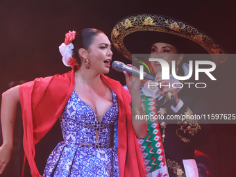 Valeria Cuevas with the Mariachi Real de la Montana performs during the Maraton de Mariachis de la Ciudad de Mexico at Zocalo main square, w...